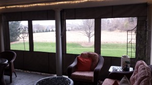 Sunbrella fabric porch curtains with clear vinyl panels
