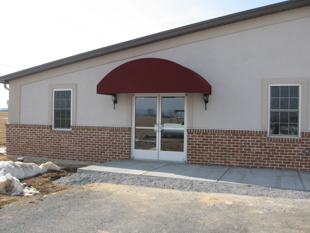 Arched top welded frame awning installed at a church in New Holland PA
