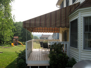 Sunbrella striped fabric awning with galvanized steel frame and ceiling fan option