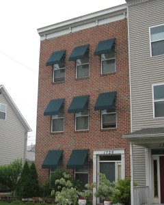 Residential green fabric window awnings