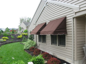Retractable traditional window awnings