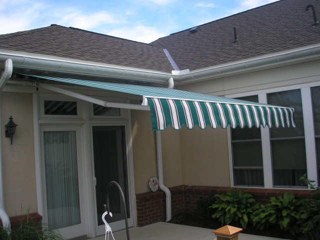 Retractable awning over a concrete patio