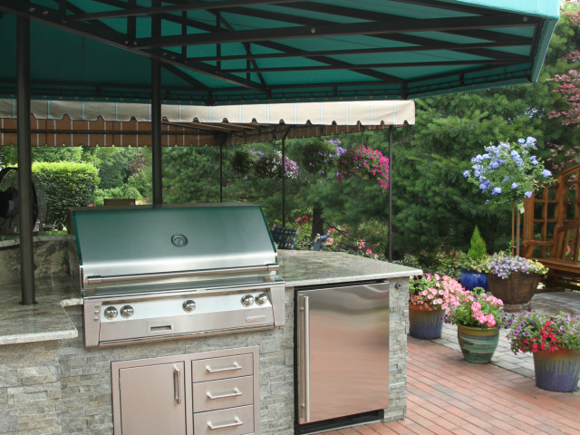 Outdoor kitchen and grill area awning cover