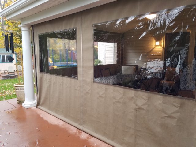 Roll up porch enclosure panels