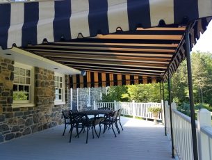Fixed awning canopy over a deck