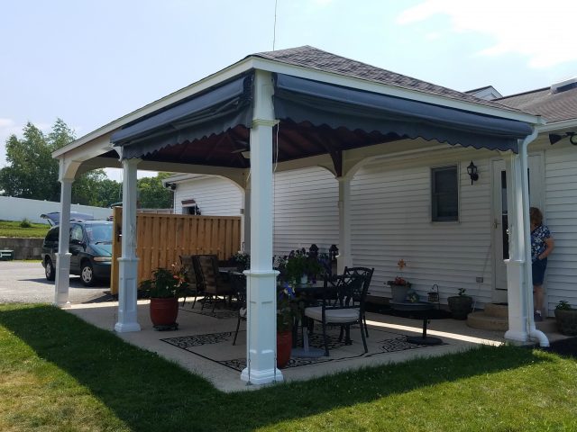 Pleated drop curtains on a gazebo - exterior up position