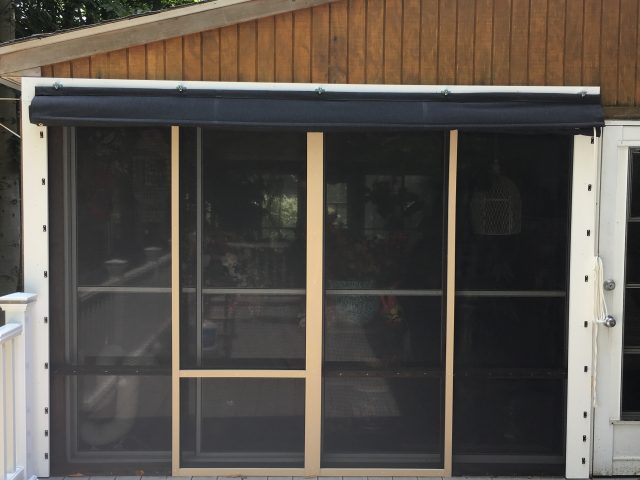 Clear vinyl drop curtain with a protective hood - up position