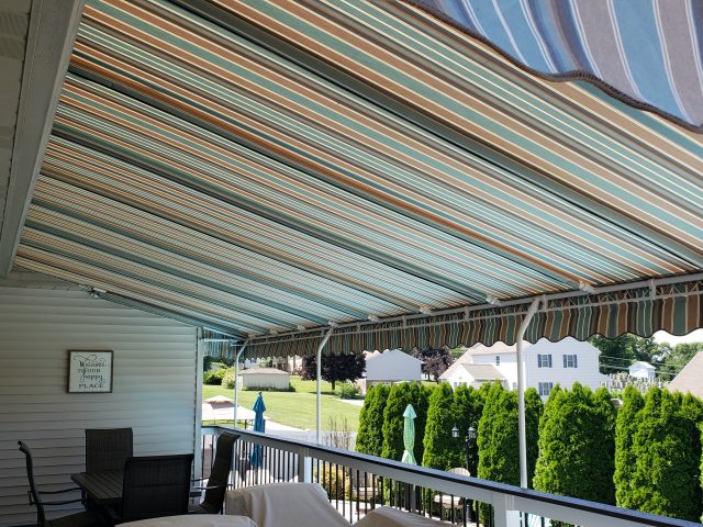 Poolside canopy shade - powder coated frame - manheim pa - striped sunbrella fabric - wave scallop---