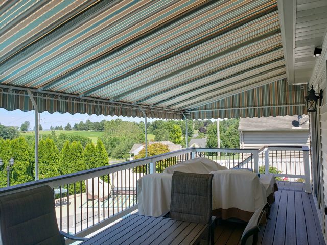 Poolside canopy shade - powder coated frame - manheim pa - striped sunbrella fabric - wave scallop----