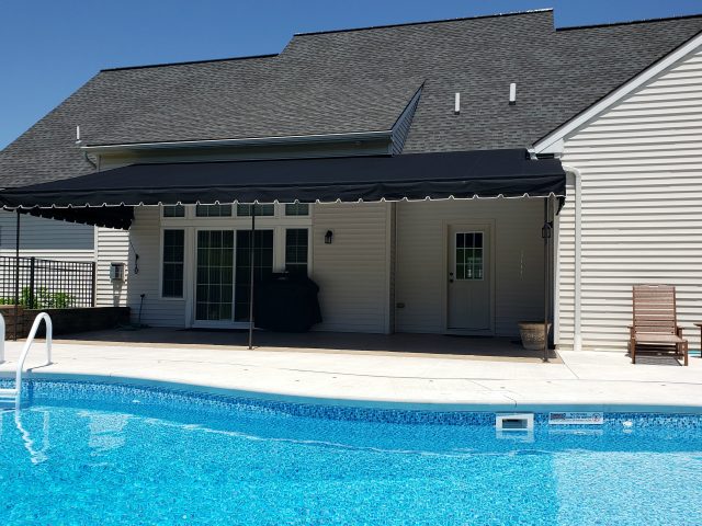 Relax by the pool - stationary canopy awning - black sunbrella fabric - powder coated frame - shade - canvas lancaster