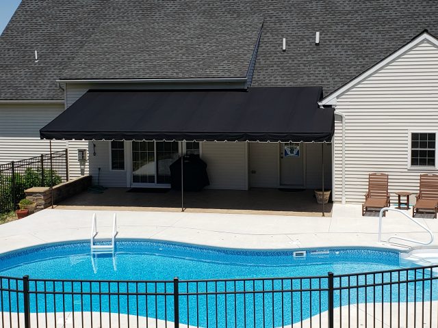 Relax by the pool - stationary canopy awning - black sunbrella fabric - powder coated frame - shade - canvas lancaster pa - black - roof mounted