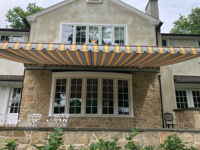eastern retractable awning sunbrella fabric striped remote controlled canopy deck patio outdoor living