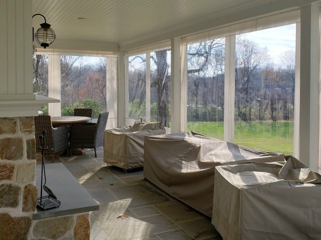 clear vinyl drop curtain enclosure on a residential porch roll up drapes blinds sunbrella fabric canvas---