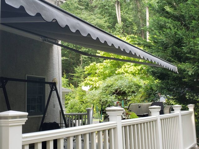 Retractable deck awning sunbrella fabric malvern lancaster pa patio cover----Kreiders canvas service-