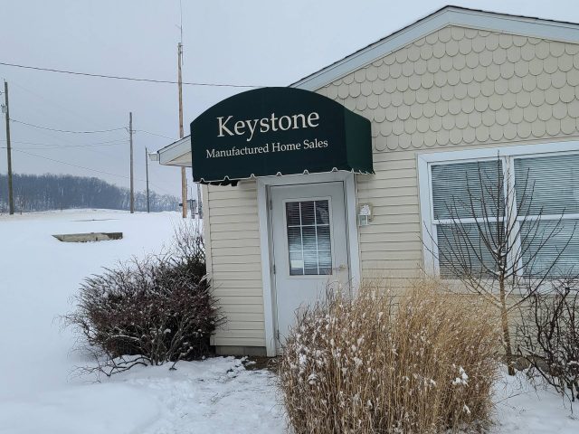 Keystone Manufactured Homes - commercial entracne awning doorhood sunbrella fabric lettering--