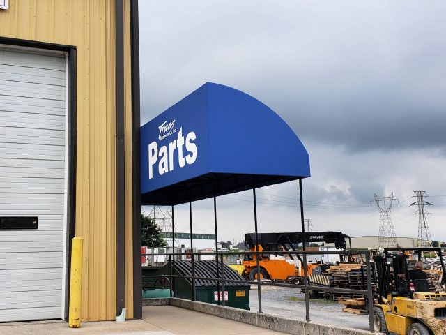 Trans Equipment Inc. Entrance Canopy with wind break panel