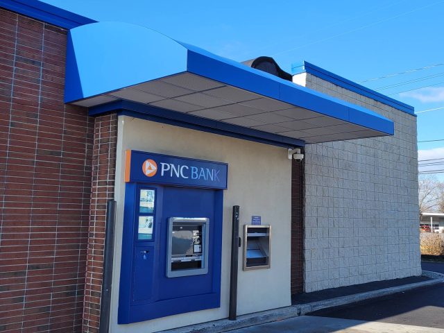 Awning over ATM drivethru at bank New Holland eggcrate vanguard vinyl ocen blue