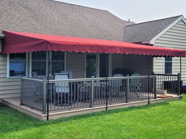 Canopy cover over a deck area New Holland Lancaster awning fabric sunbrella burgundy drop curtain
