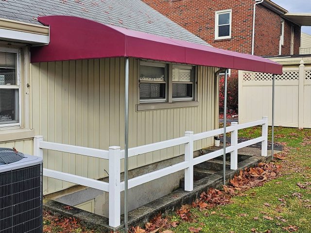 entrance canopy awning over basement steps fixed frame burgundy vanguard fabric cover lancaster pa